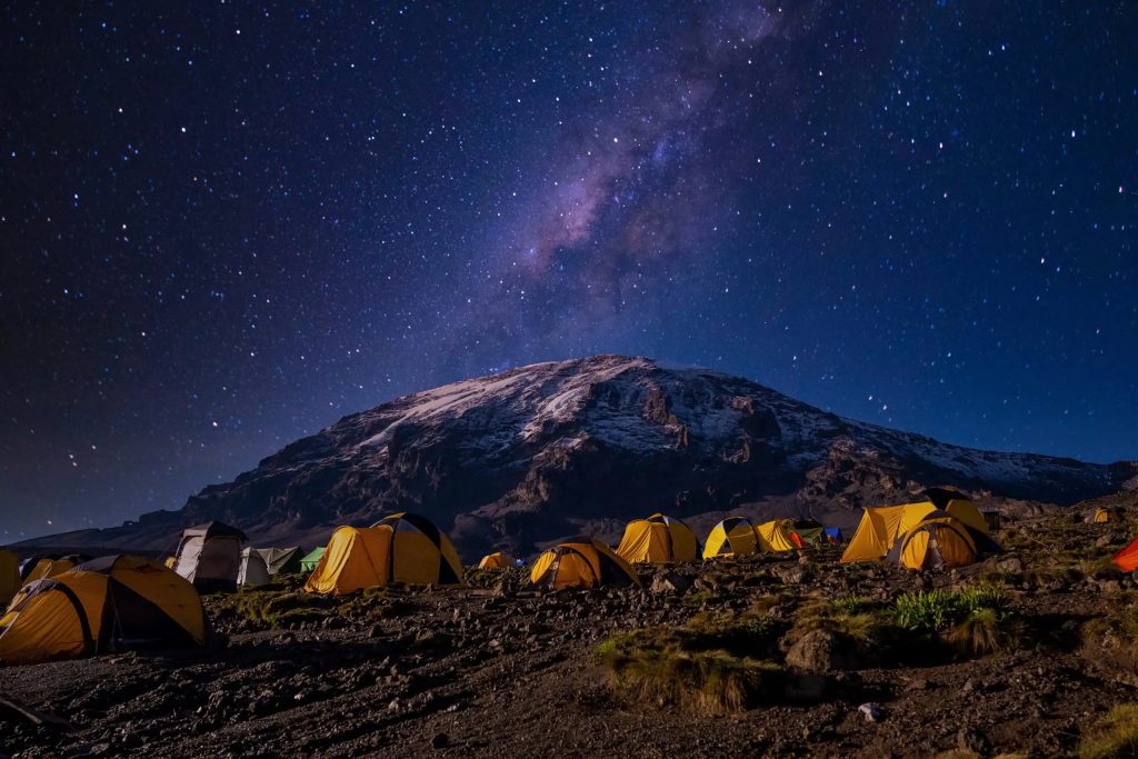 beautiful-scenery-yellow-tents-kilimanjaro-national-park-scaled
